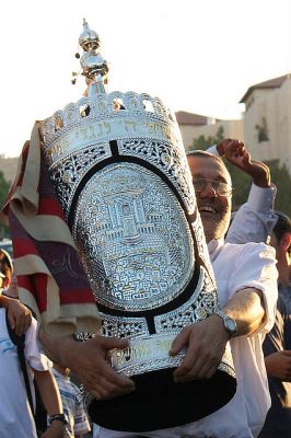 Israeli man carries the Torah Israeli man-carries-Torah-decorated wood-silver case-tik