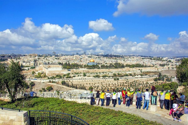 Tourists on the Mount of Olives look toward the Temple Mount where the First and Second Jewish Temples once stood in Jerusalem. Tourists on the Mount of Olives look toward the Temple Mount where the First and Second Jewish Temples once stood in Jerusalem.